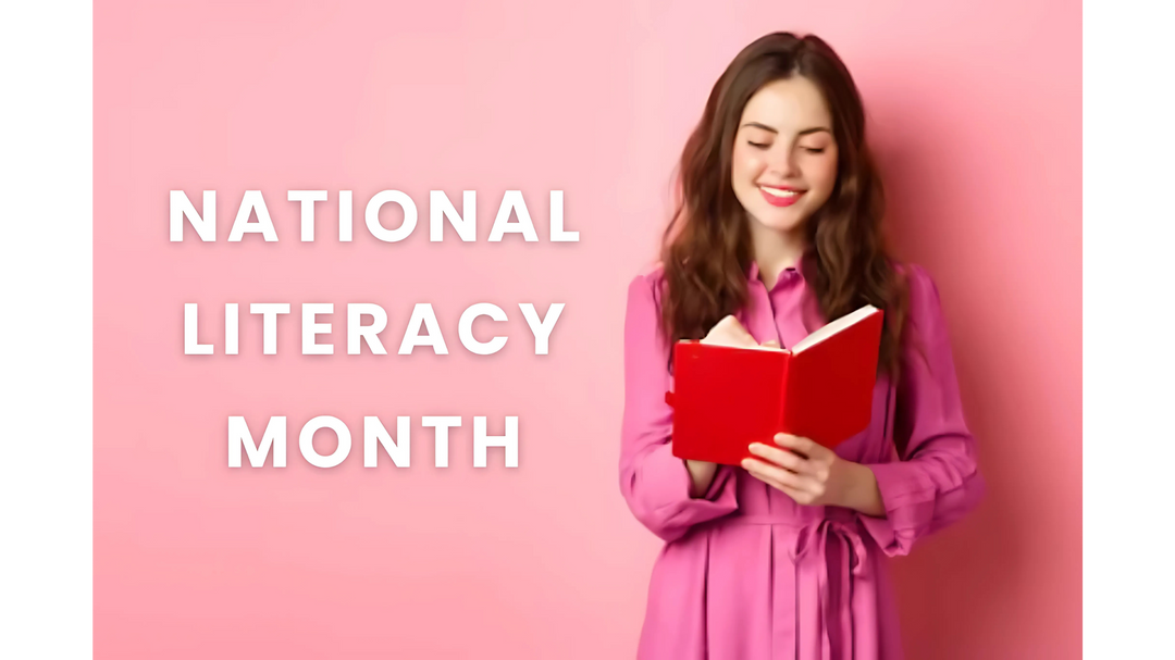 National Literacy Month Image: A smiling woman in a pink dress reading a red book against a matching pink background with the text "National Literacy Month