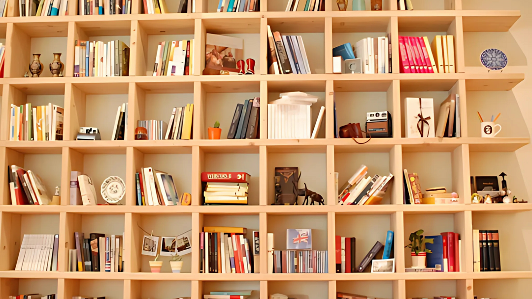 A large wooden bookshelf filled with books, decorative items, and trinkets, creating a cozy and organized reading space.