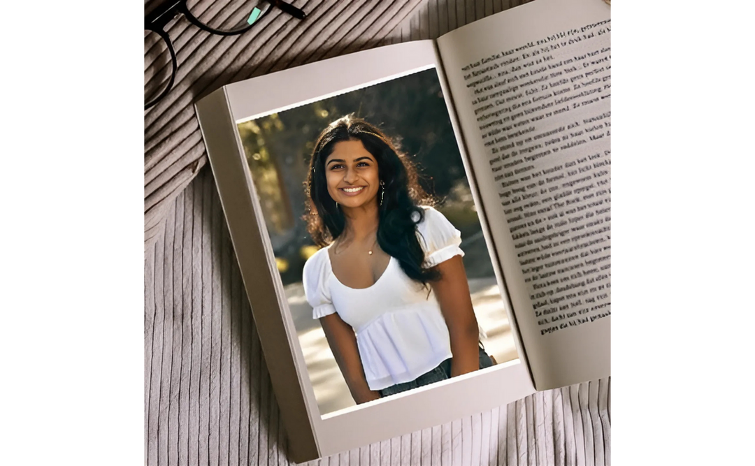 An open book with text on the right side and a picture of the Indian American young adult author Ananya Devarajan on the left.