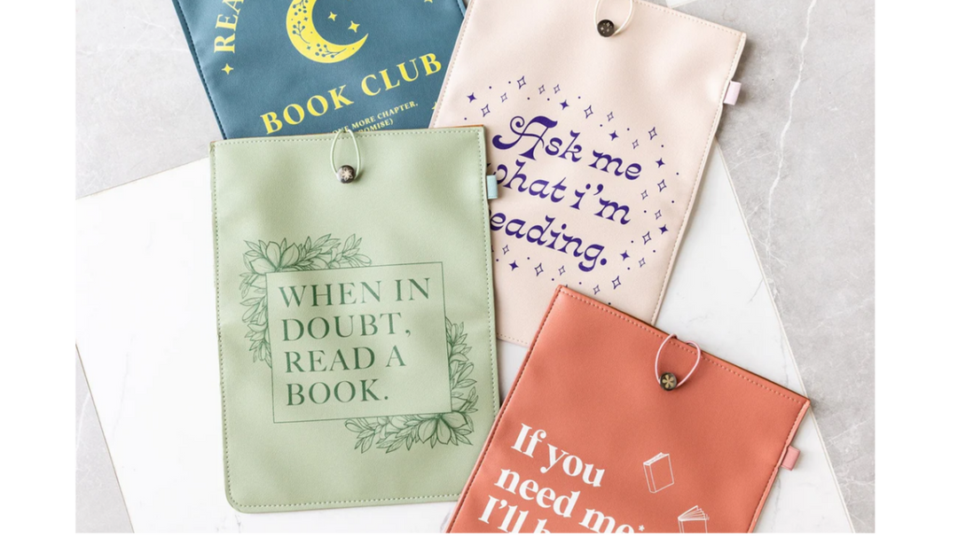 Pastel book sleeves with literary quotes and moon design, arranged flat to showcase different colours and reading-themed messages.