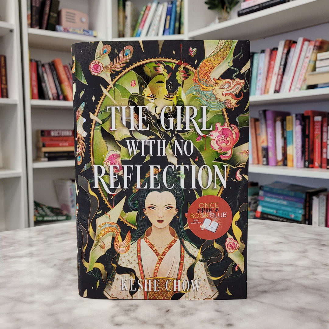 a hardcover copy of The Girl With No Reflection by Keshe Chow