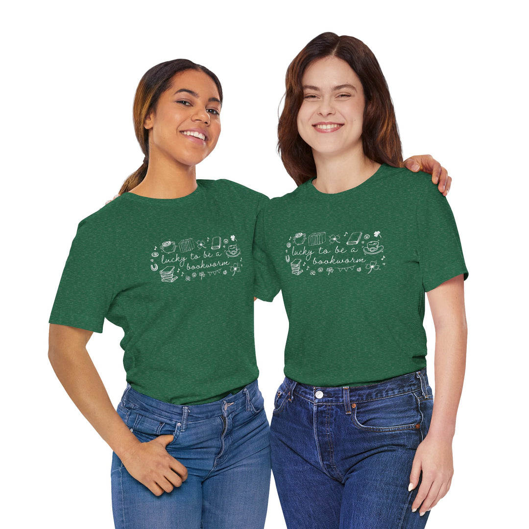 Two people wearing green t-shirts with white font reading "lucky to be a bookworm" and line illustrations of St. Patrick's Day items and books on a white background