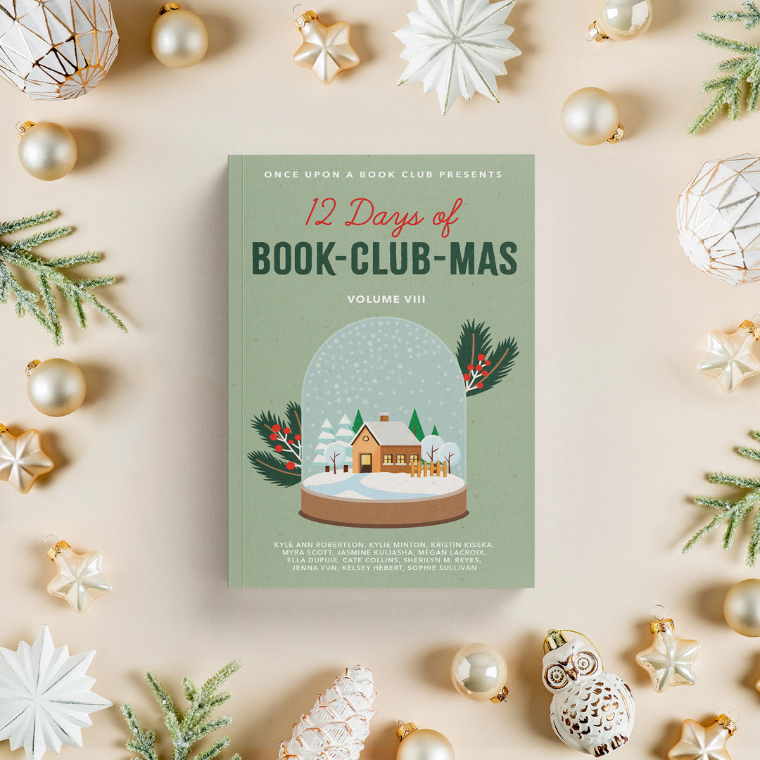Book titled '12 Days of Book-Club-Mas' surrounded by Christmas decorations on a beige background