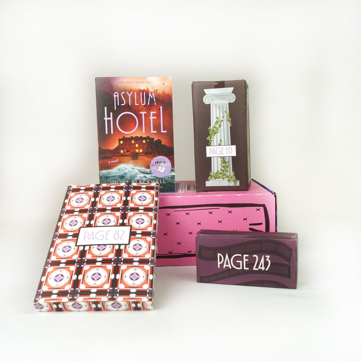 A paperback copy of Asylum Hotel by Juliet Blackwell surrounded by wrapped gifts labeled with page numbers.