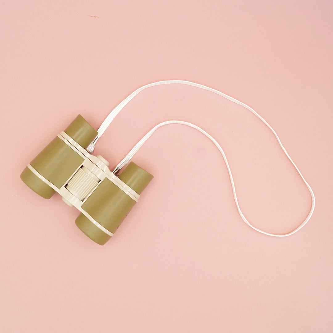 Olive green binoculars with a white neck strap