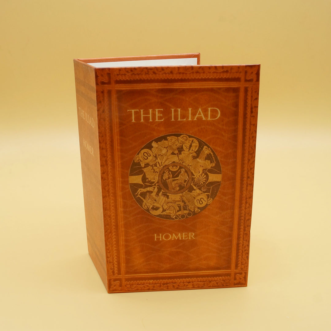 a fan shaped like the book The Iliad sits against a yellow background 