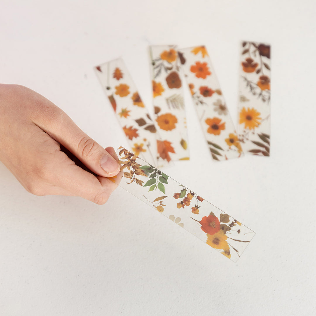 A set of five pressed flower bookmarks.