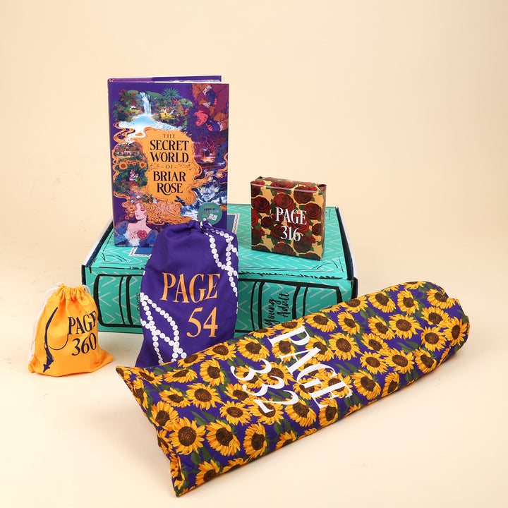 A new deluxe hardcover copy of The Secret World of Briar Rose by Cindy Pham sits on a green OUABC box. Also pictured are four wrapped gifts labeled with page numbers to open as you read!