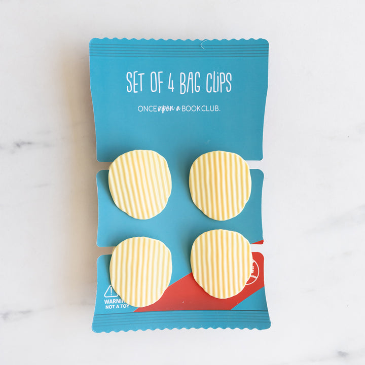 A set of four 'chip' clips on a card representing a bag of chips.