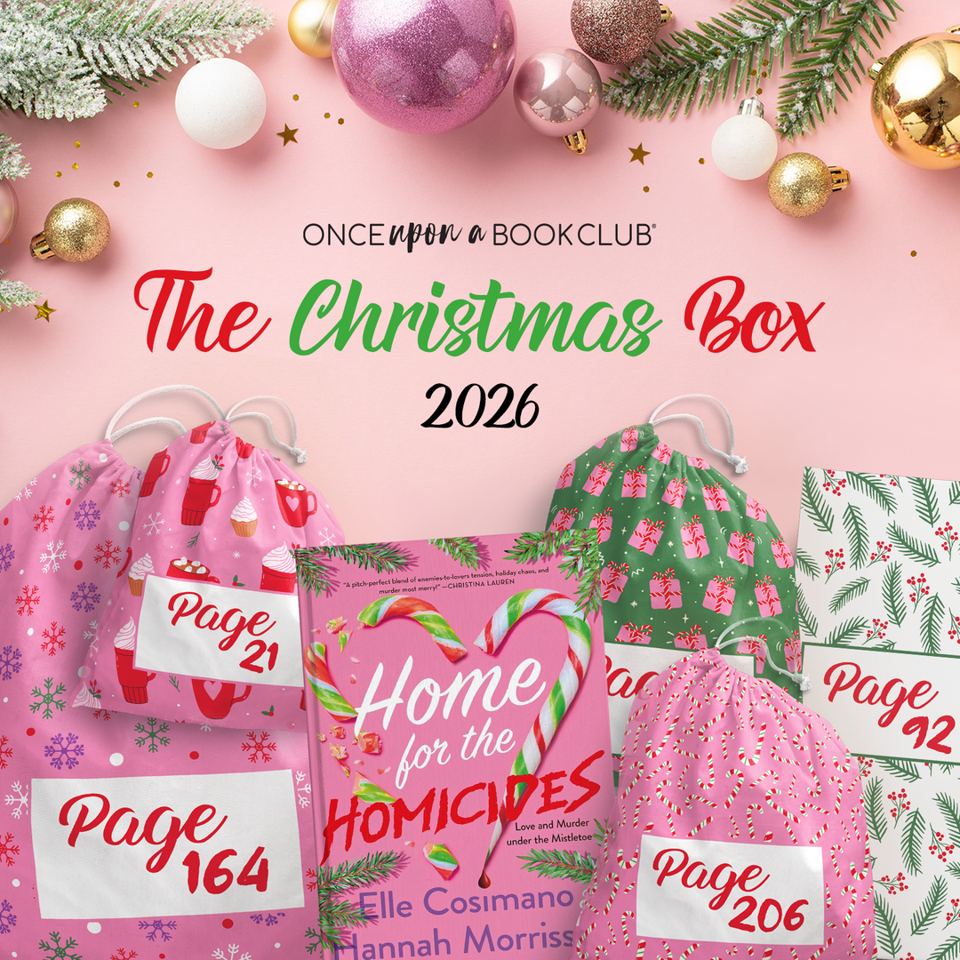 Promotional graphic for 'The Christmas Box 2026' by Once Upon a Book Club, featuring a pink book titled 'Home for the Homicides' by Elle Cosmano and Hannah Morrissey, surrounded by festive Christmas ornaments, pine branches, and multiple pink drawstring gift bags labeled with page numbers, all arranged on a light pink background.