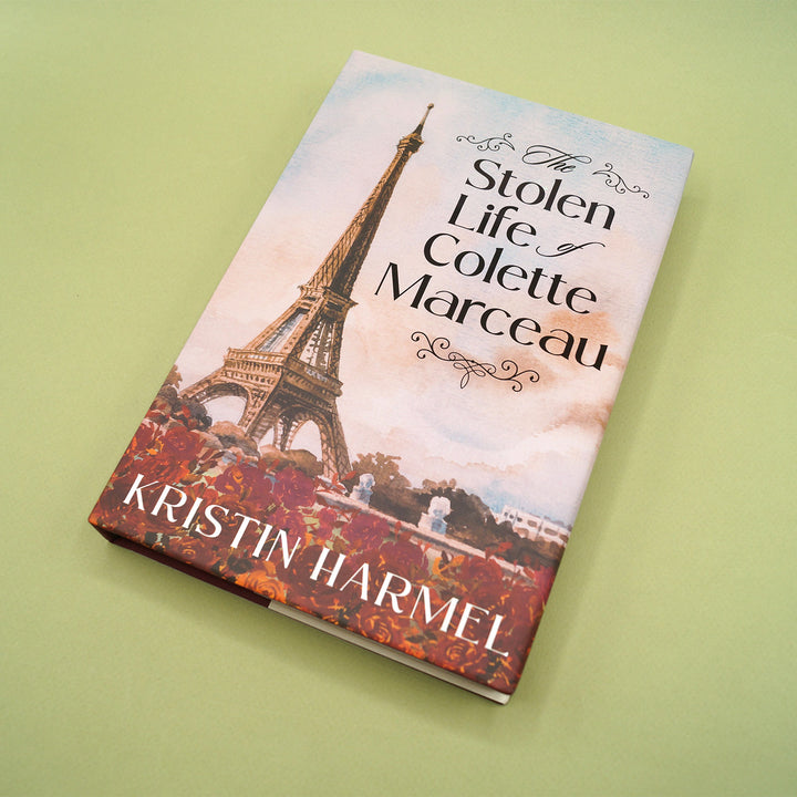 Book cover of 'The Stolen Life of Colette Marceau' by Kristin Harmel with Eiffel Tower illustration on a green background