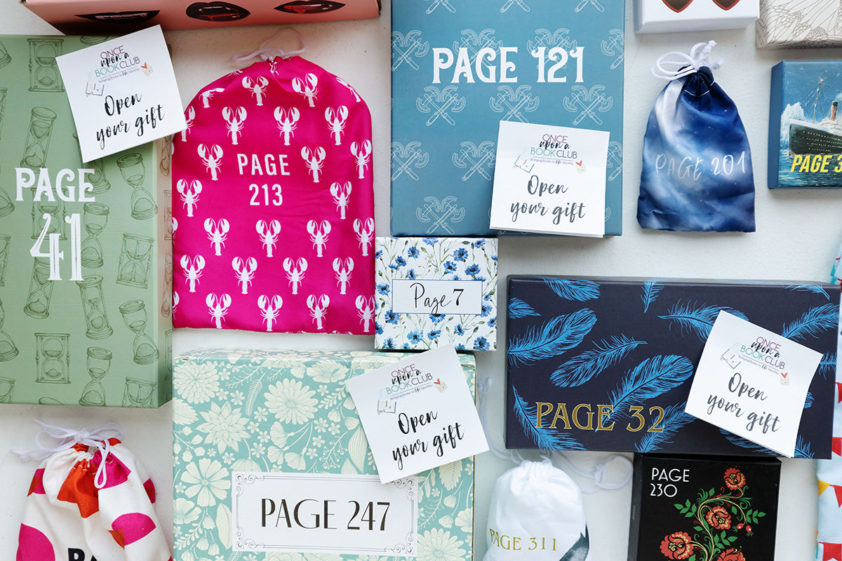 A collection of gifts wrapped in multi-colored packaging all labeled with page numbers. Scattered among the gifts are 