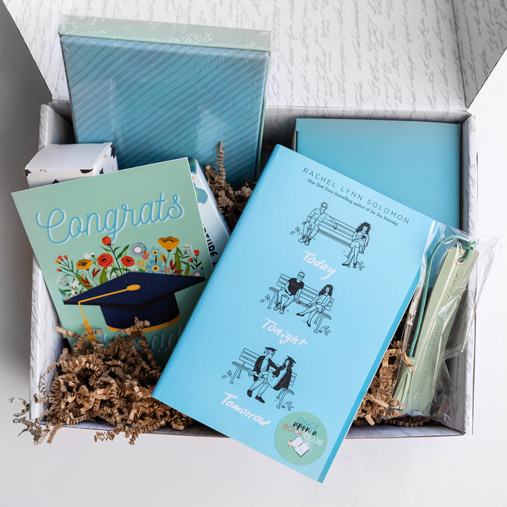 An open Graduation box shows a copy of Today Tonight Tomorrow and the other included items.