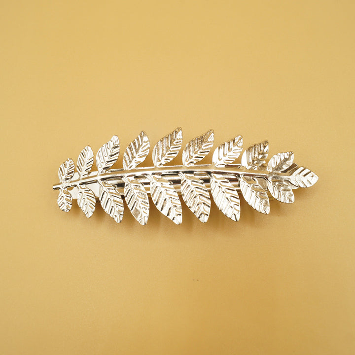 A silver leaf hair clip.