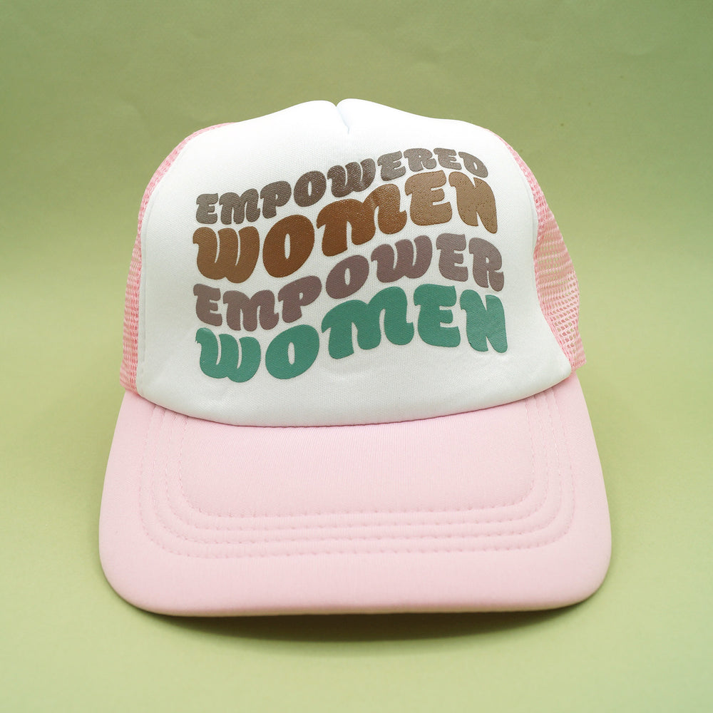 a pink snapback trucker hat that says "empowered women empower women" on the front