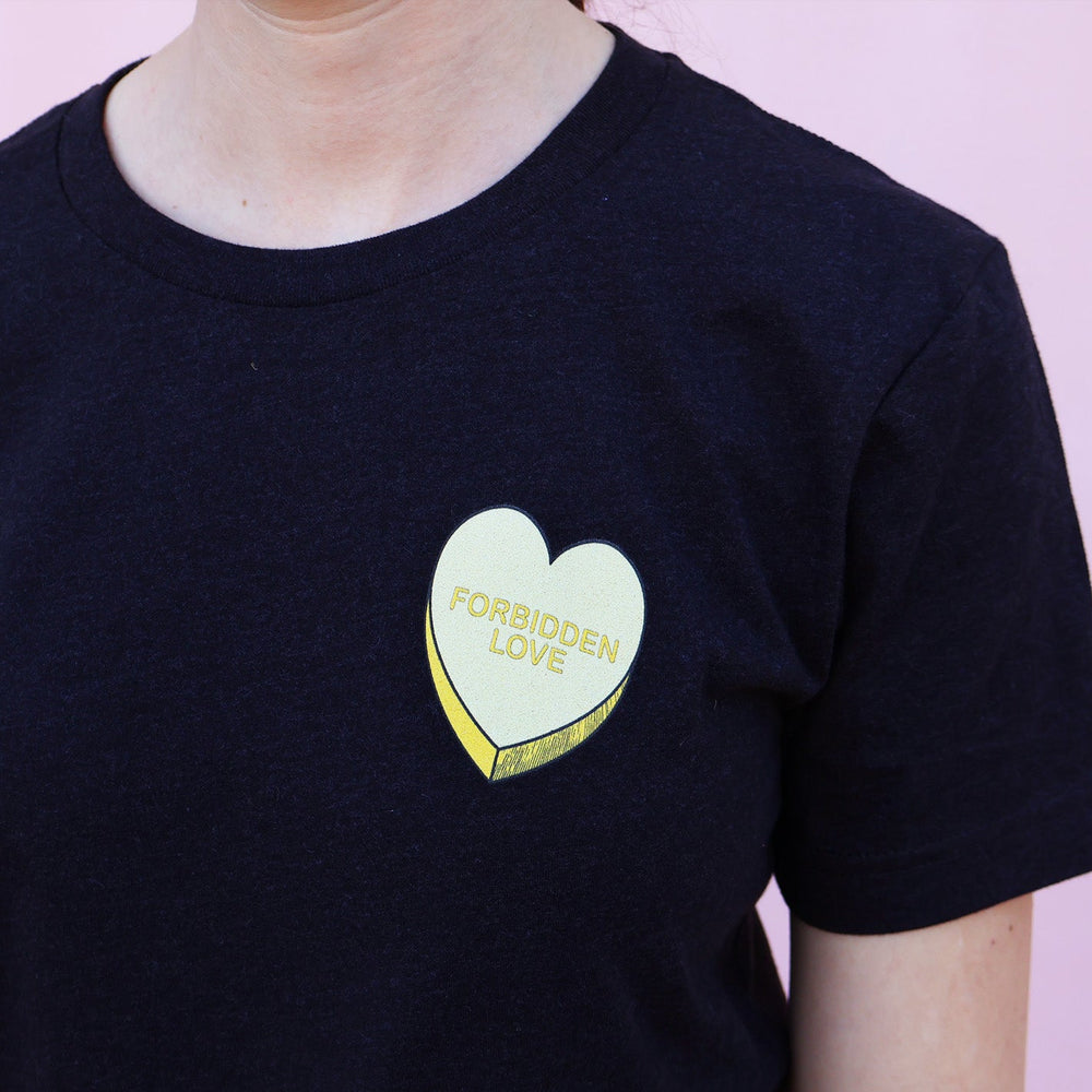 Black t-shirt with a heart-shaped 'Forbidden Love' design on a pink background