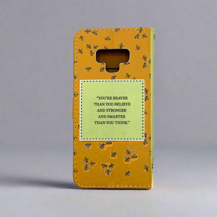 The back cover of a book-shaped phone case inspired by Winnie-the-Pooh by A.A. Milne.