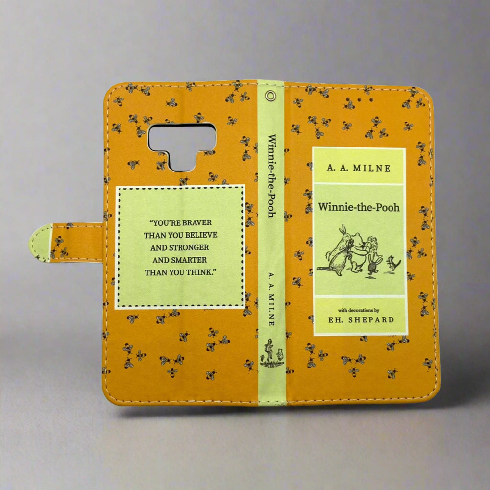 The front and back cover of a book-shaped phone case inspired by Winnie-the-Pooh by A.A. Milne.