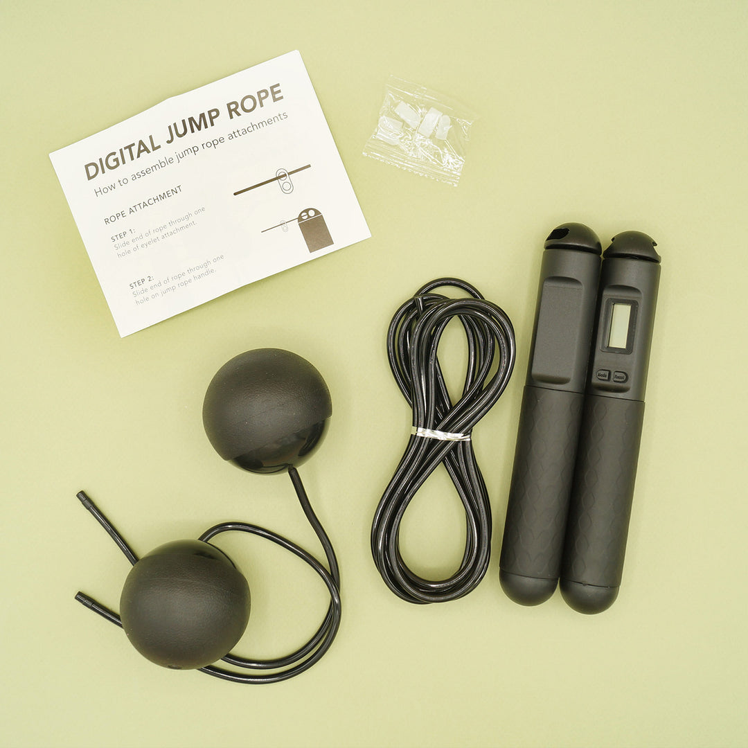 a digital jump rope kit including weighted attachments, a standard rope attachment, handles, and instructions.