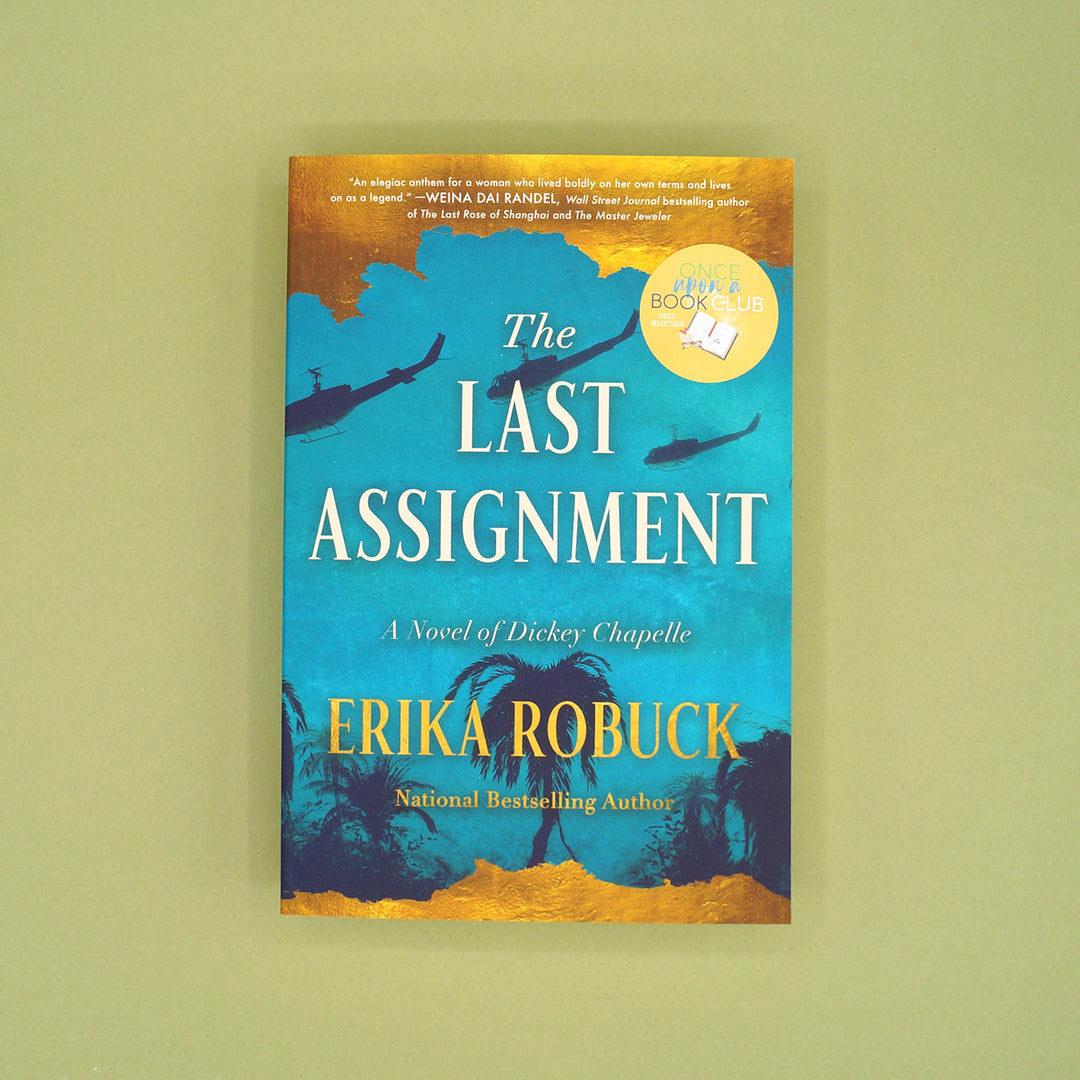 Book cover of 'The Last Assignment' by Erika Robuck on a green background