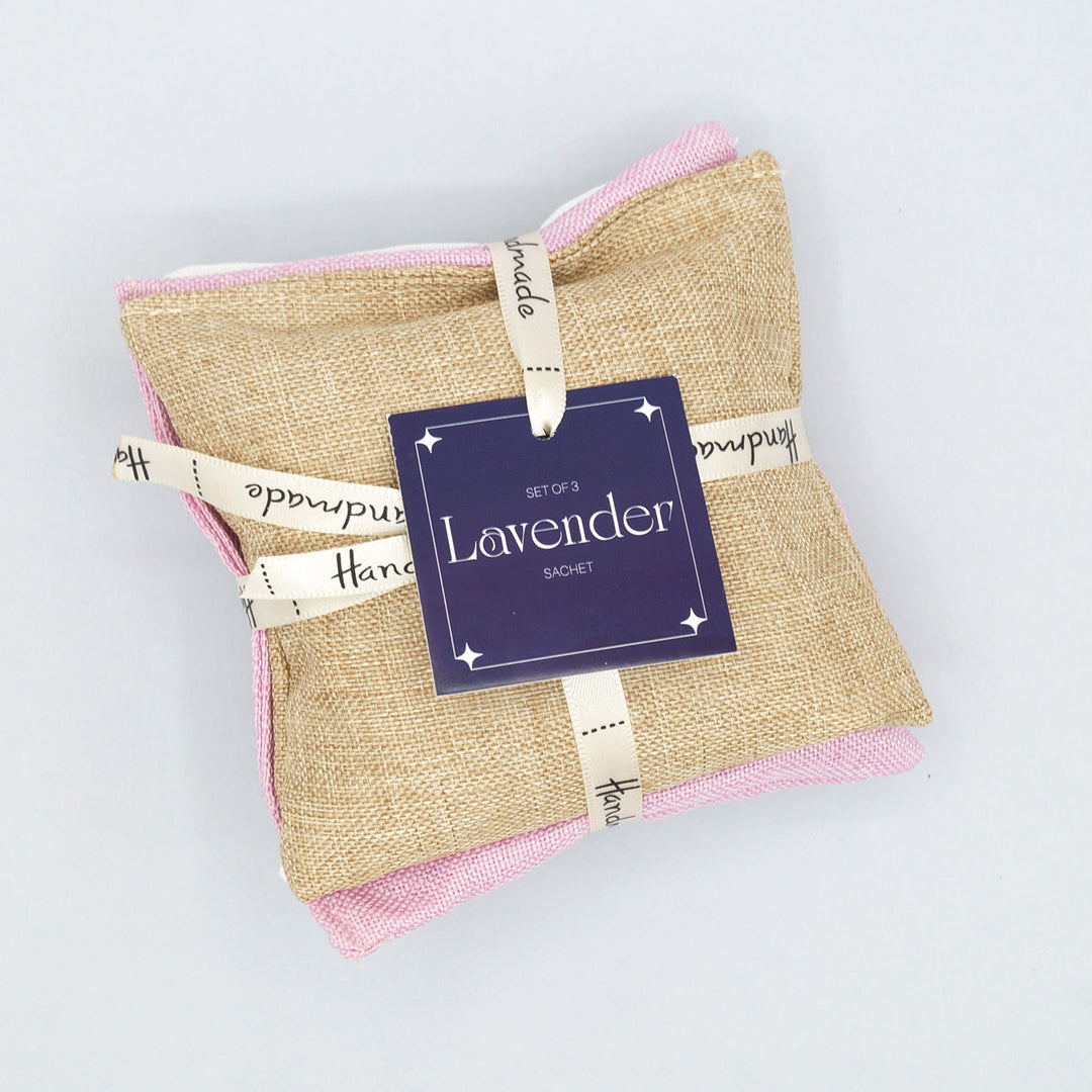 a stack of 3 lavender sachets in tan, pink, and white (one color each)