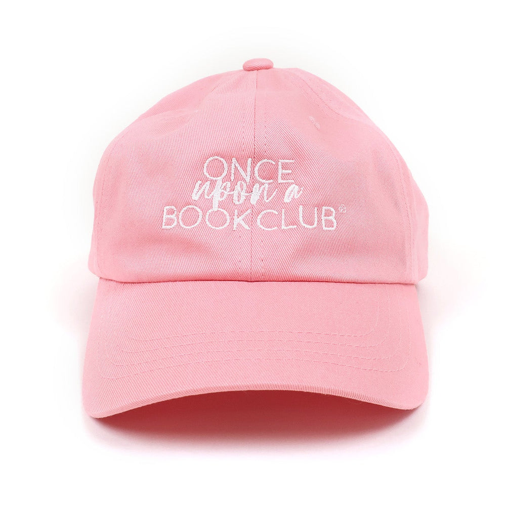 A pink baseball cap with white embroidered text reading 'Once Upon a Book Club' on the front, shown against a plain white background.
