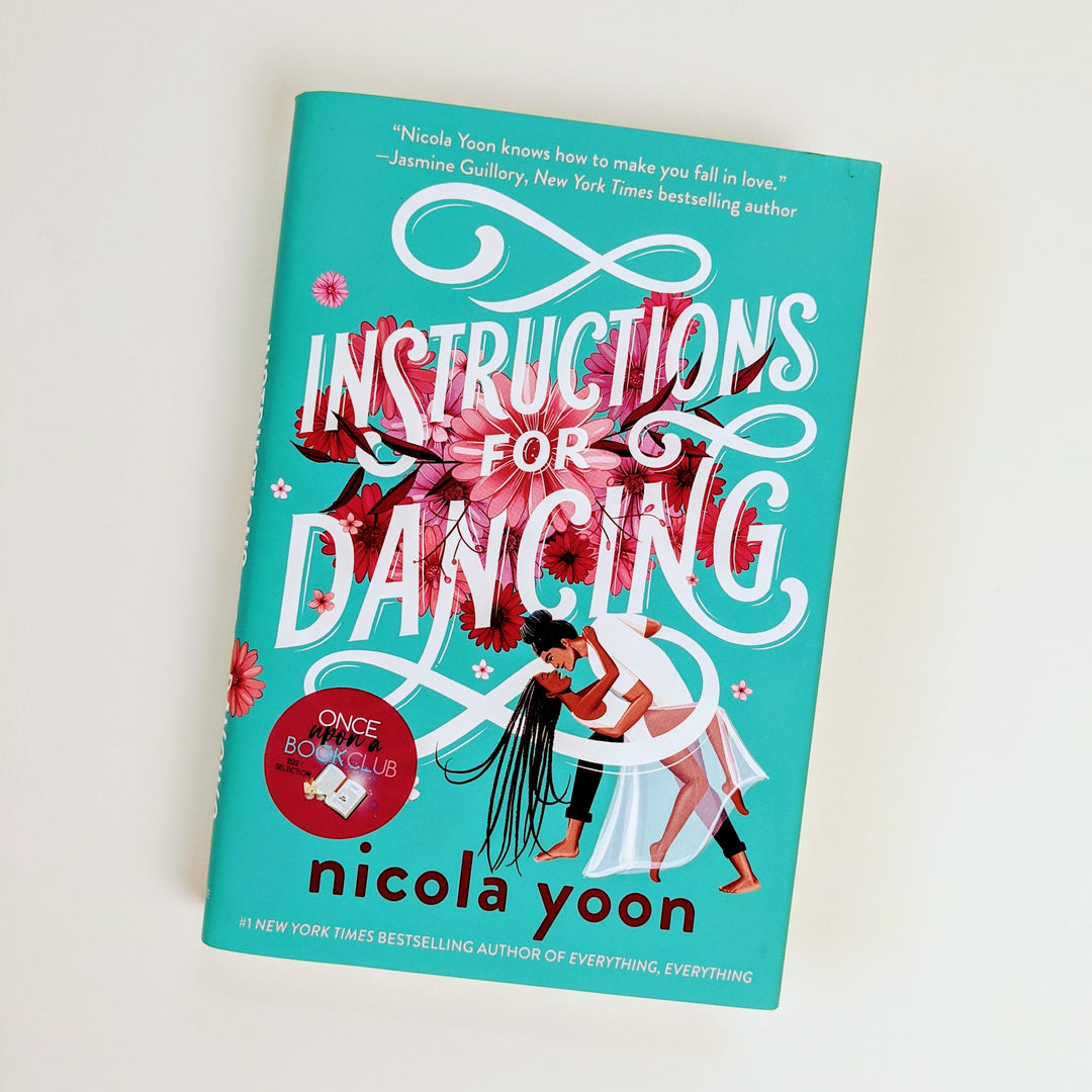 A hardcover copy of Instructions for Dancing by Nicola Yoon sits on a white background.