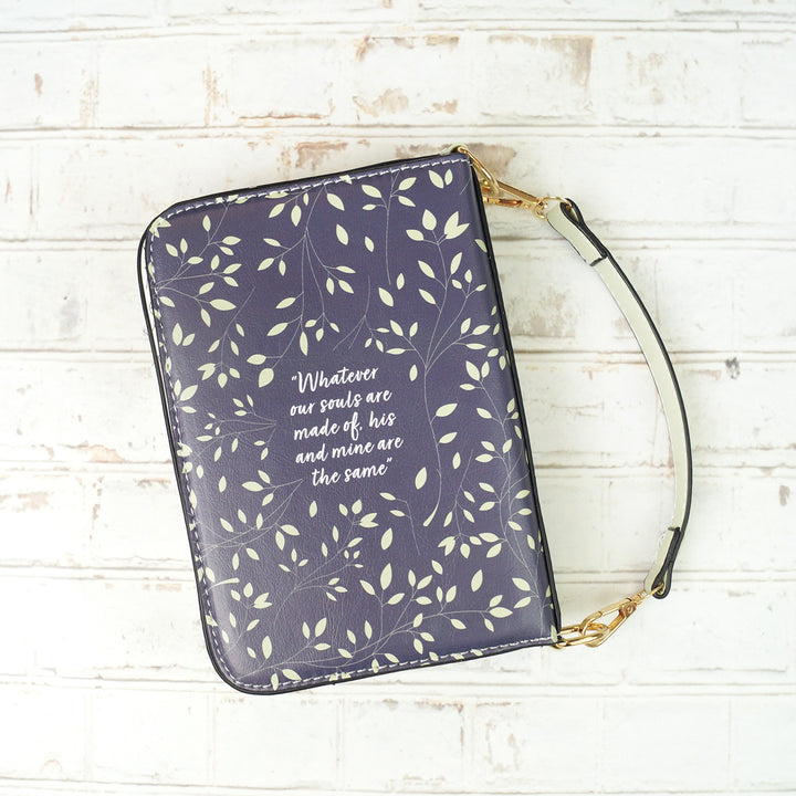 A book-shaped purse inspired by Wuthering Heights by Emily Brontë. The back of the purse is visible surrounded by leafy vines and the quote in the middle is "Whatever our souls are made of, his and mine are the same."