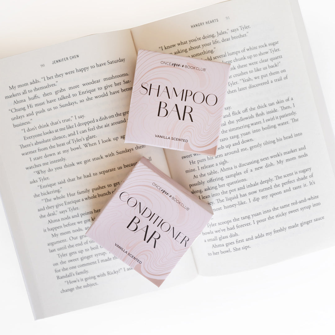 An open book with two square boxes on the pages - Shampoo Bar and Conditioner Bar.