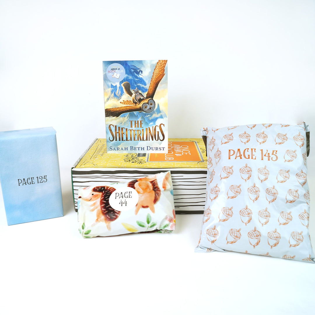 A paperback copy of The Shelterlings by Sarah Beth Durst stands on top of a yellow Once Upon a Book Club Middle Grade box. Surrounding this is three wrapped gifts labeled with page numbers.