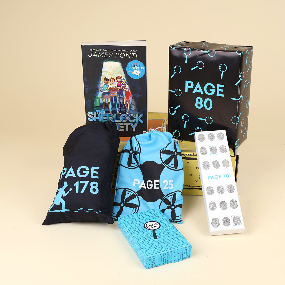 A paperback edition of The Sherlock Society by James Ponti stands on a yellow OUABC box next to a wrapped black box with blue magnifying glasses on it labeled with a page number. In front of the box are four more themed wrapped gifts labeled with page numbers.
