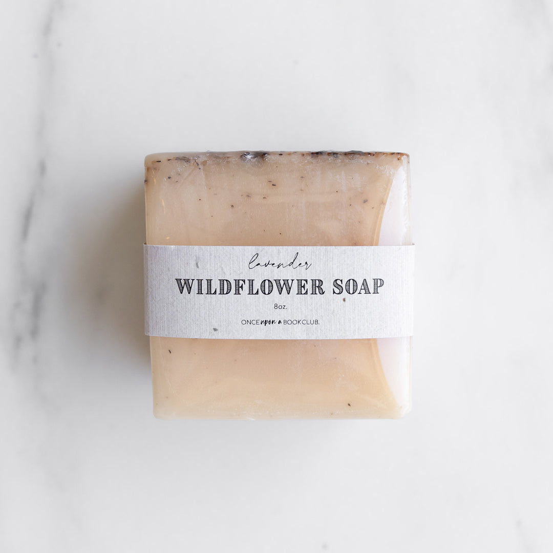 a bar of beige-colored soap with the label lavender wildflower soap 8oz on it