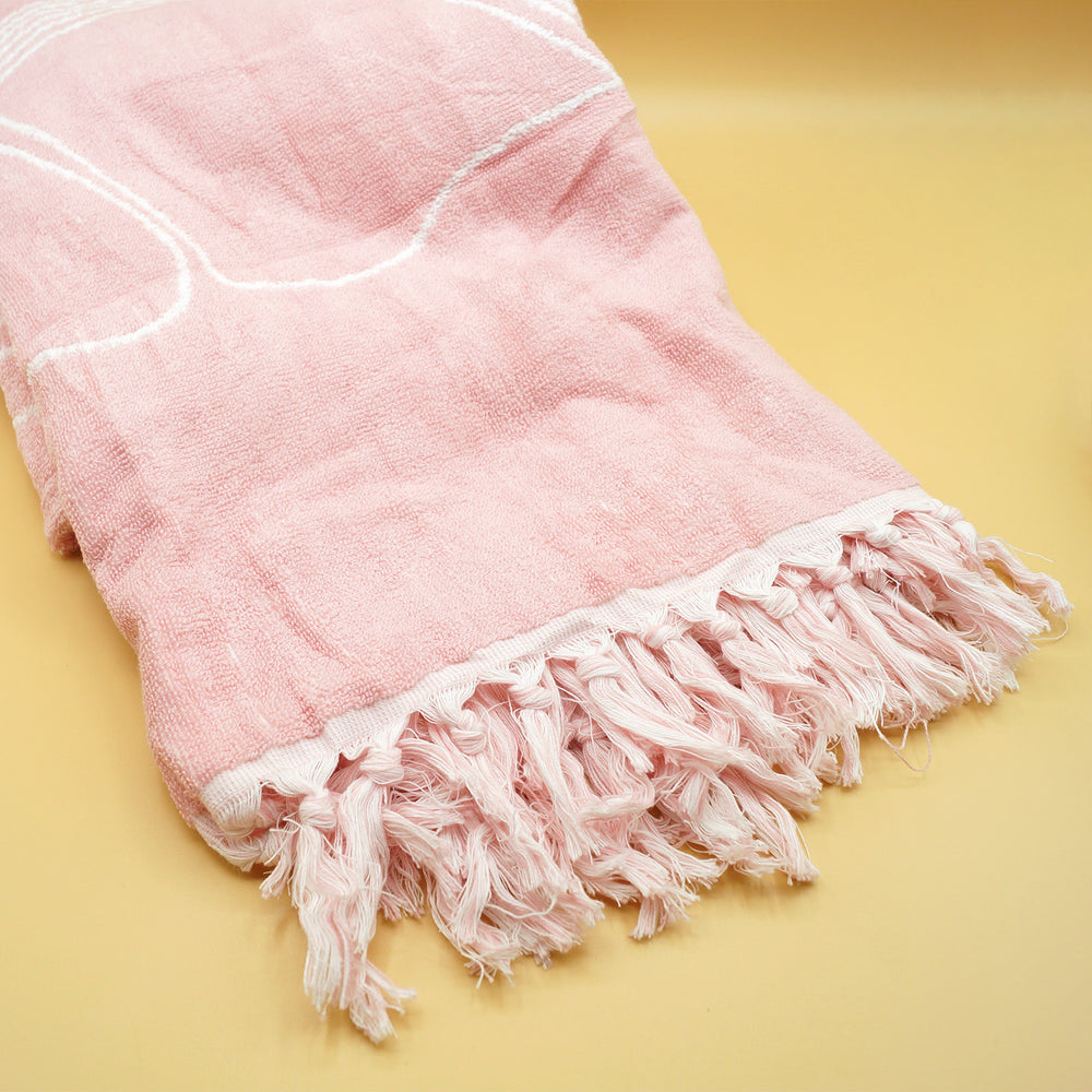 a pink towel on a yellow background