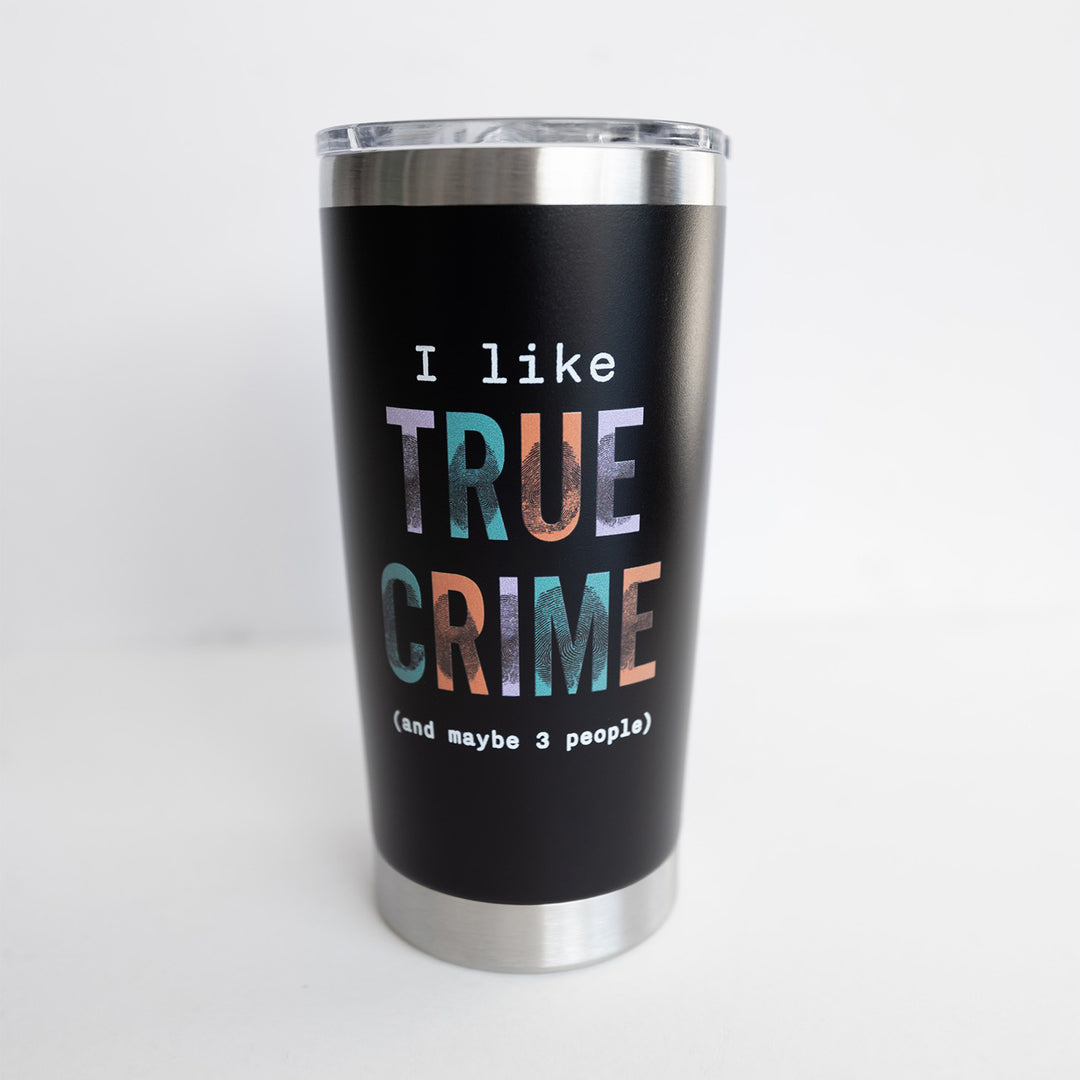 A black tumbler that says I Like True Crime (and maybe 3 people). The words True Crime have different colors for each letter and fingerprint smudges over the letters.