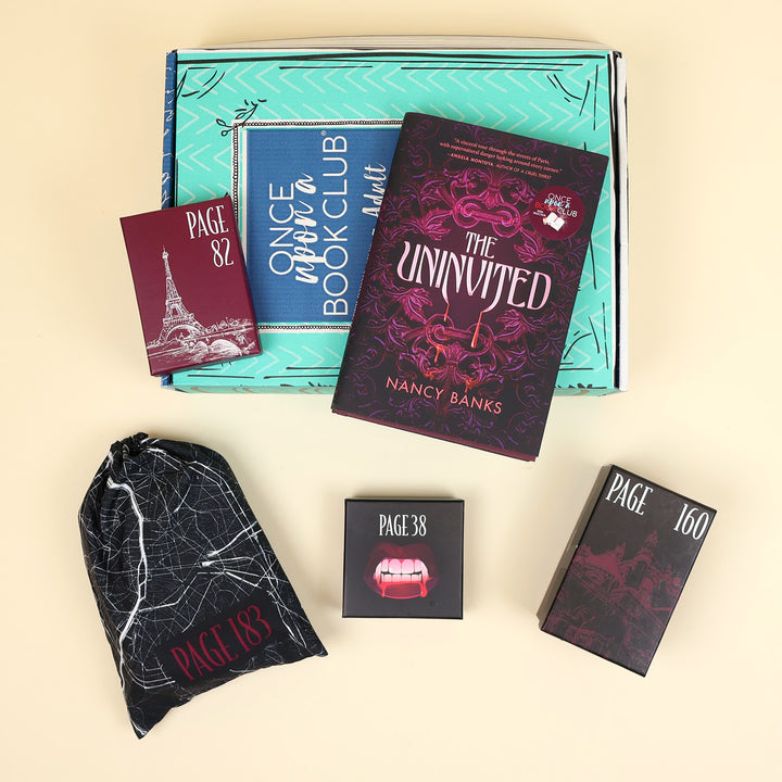 A hardcover edition of The Uninvited stands on a green OUABC box next to a wrapped gift labeled with a page number. In front of the box are three more themed wrapped gifts labeled with page numbers.