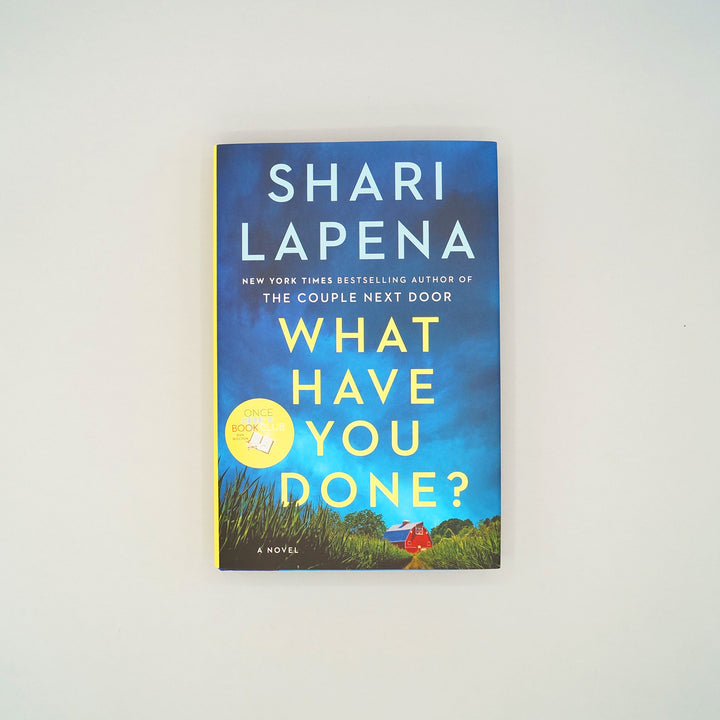 A hardcover copy of What Have You Done? by Shari Lapena sits on a white background. 