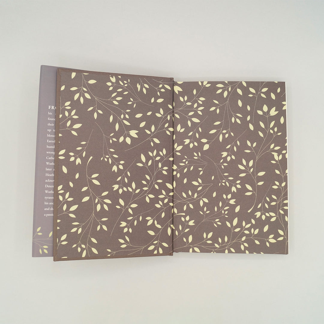 The custom endpapers on the exclusive edition of Wuthering Heights by Emily Brontë featuring leaves on vines.