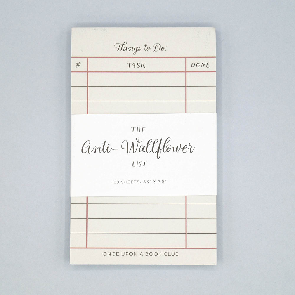 a white notepad labeled Things to Do with a white label across the center that says The Anti-Wallflower List