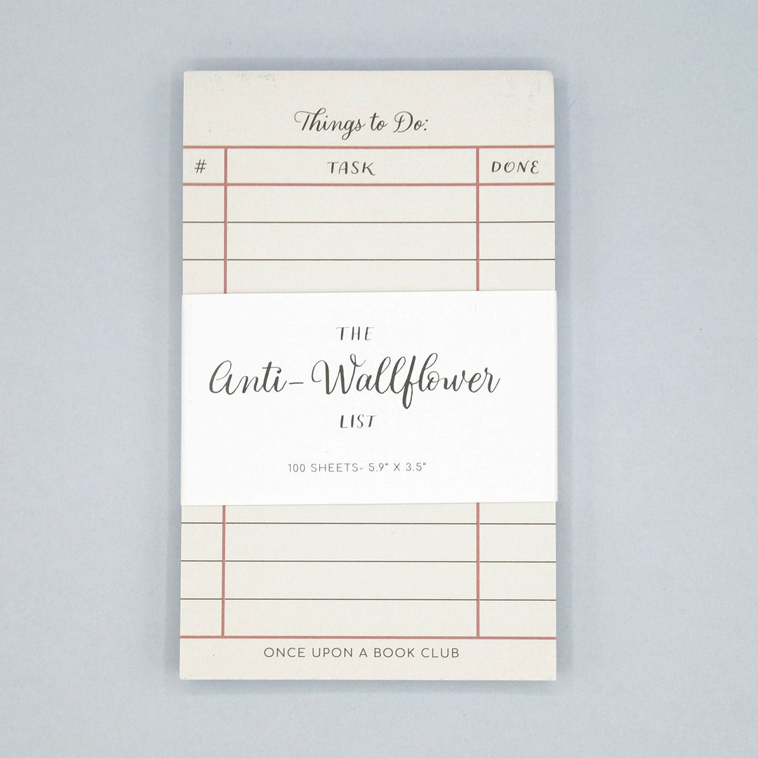 a white notepad labeled Things to Do with a white label across the center that says The Anti-Wallflower List