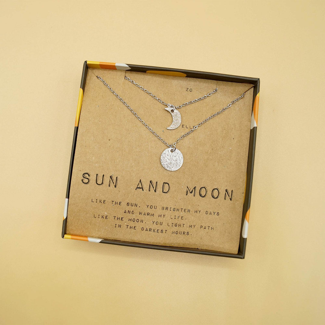 a sun and moon silver necklace set